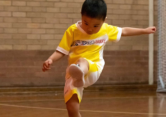 Child playing soccer