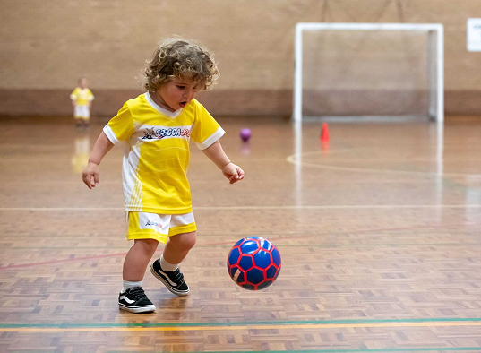 Child playing soccer
