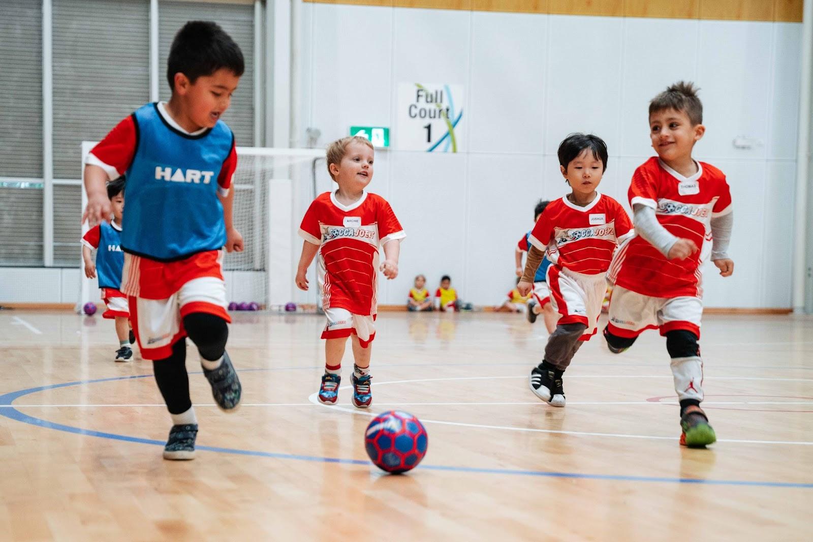 sportsmanship image kids playing soccer